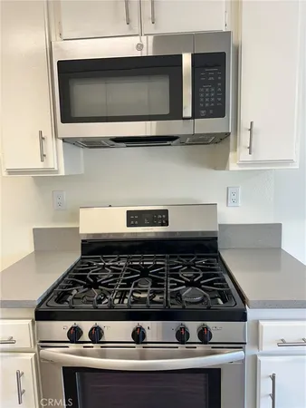 a view of hallway with stairs and wooden floor