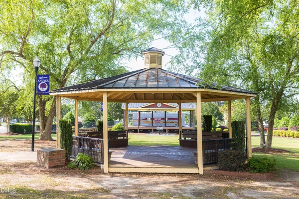 a view of a water fountain and sitting area