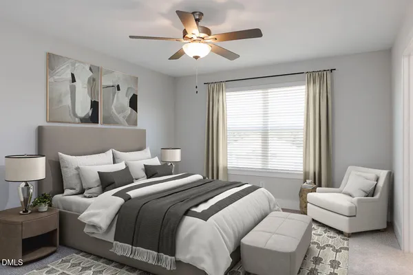 a bedroom with a bed and a couch