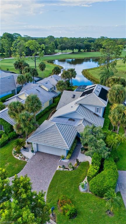 224 Edgemere Way South Naples, FL 34105 - Photo 1 of 35 Aerial view of property and surrounding area with a tree filled landscape and a large body of water
