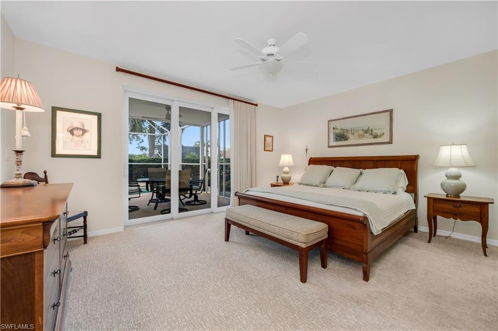 224 Edgemere Way South Naples, FL 34105 - Photo 11 of 35 Bedroom featuring light colored carpet, access to exterior, a ceiling fan, and a sunroom