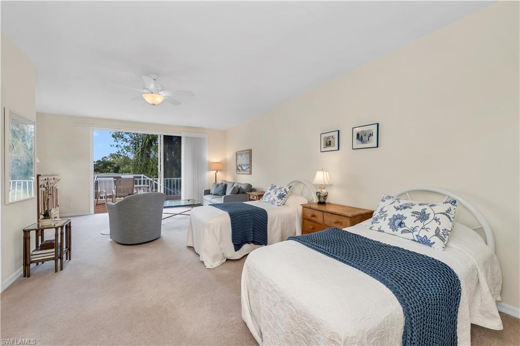 224 Edgemere Way South Naples, FL 34105 - Photo 14 of 35 Carpeted 2nd floor bedroom featuring access to exterior and a ceiling fan