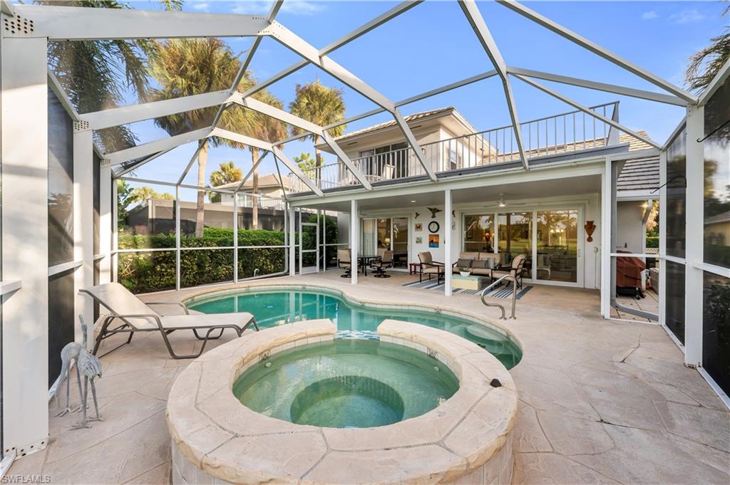 224 Edgemere Way South Naples, FL 34105 - Photo 22 of 35 View of pool with a sunroom, a lanai, a patio area, and an outdoor hangout area
