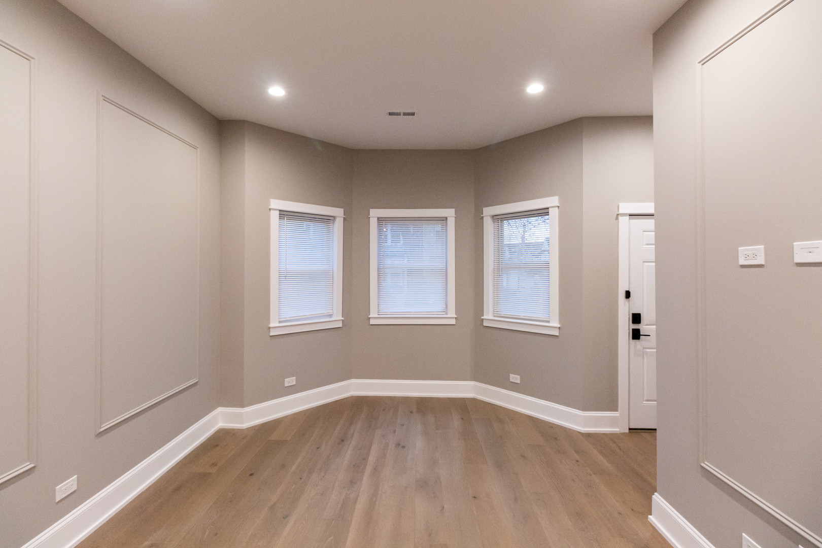 1714 North Spaulding Avenue, Unit 1F Chicago, IL 60647 - Photo 13 of 25 a view of an empty room with wooden floor and a window