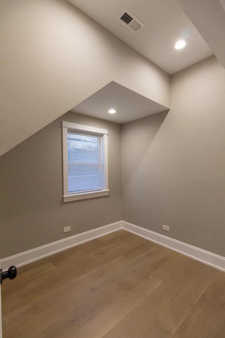 1714 North Spaulding Avenue, Unit 1F Chicago, IL 60647 - Photo 15 of 25 an empty room with a window
