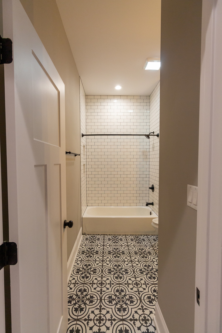 1714 North Spaulding Avenue, Unit 1F Chicago, IL 60647 - Photo 17 of 25 a bathroom with a shower and a toilet