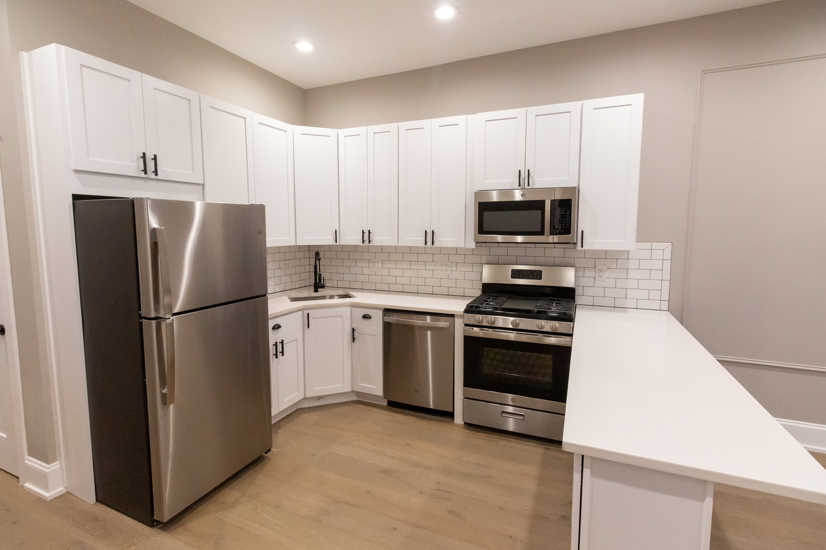 1714 North Spaulding Avenue, Unit 1F Chicago, IL 60647 - Photo 3 of 25 a kitchen with a refrigerator and a stove