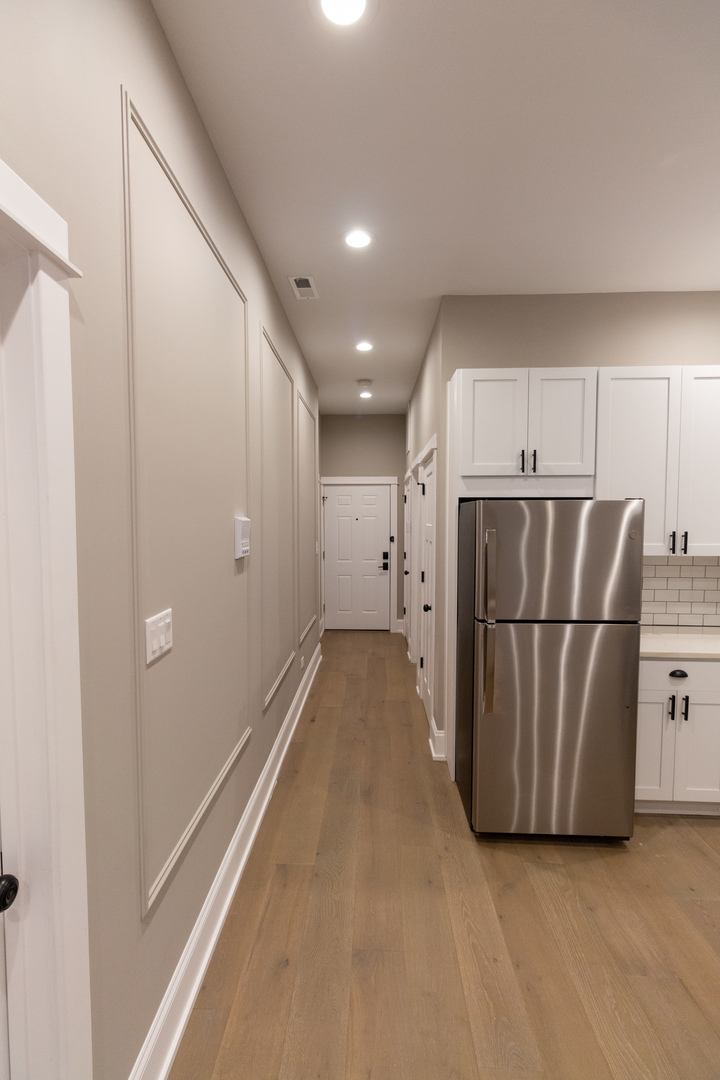 1714 North Spaulding Avenue, Unit 1F Chicago, IL 60647 - Photo 8 of 25 a view of kitchen with refrigerator and microwave