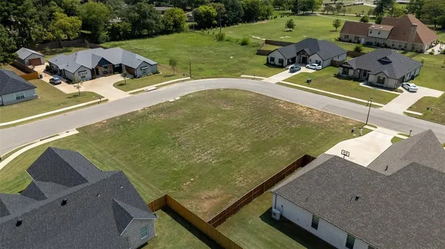 an aerial view of a house with outdoor space