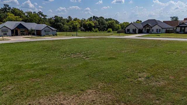 a view of a house with yard and a garden