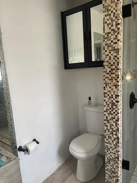 2131 Cascades Boulevard, Unit 301 Kissimmee, FL 34741 - Photo 15 of 30 a white toilet sitting next to a bathroom sink