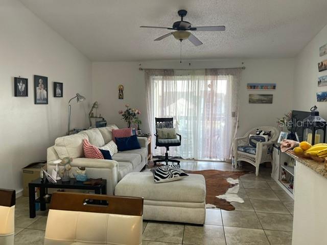 2131 Cascades Boulevard, Unit 301 Kissimmee, FL 34741 - Photo 21 of 30 a living room with furniture