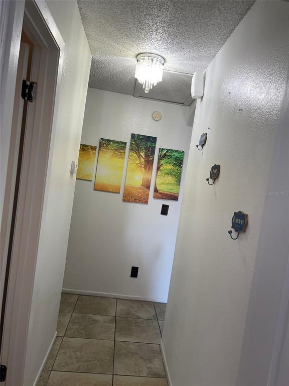 2131 Cascades Boulevard, Unit 301 Kissimmee, FL 34741 - Photo 4 of 30 a view of a hallway