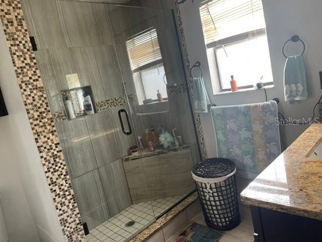 2131 Cascades Boulevard, Unit 301 Kissimmee, FL 34741 - Photo 8 of 30 a bathroom with a sink toilet and shower