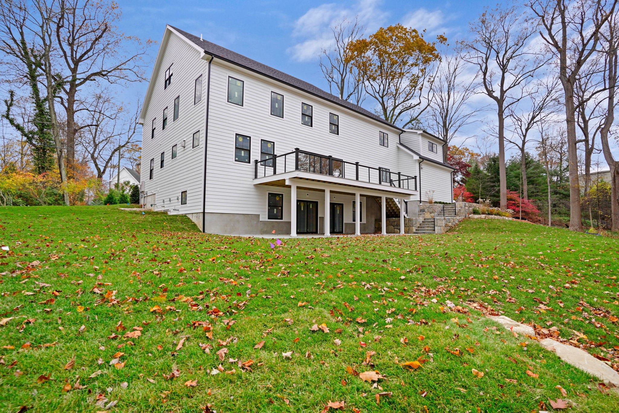 13 Terhune Drive Westport, CT 06880 - Photo 11 of 28 a large white building with a big yard and large trees