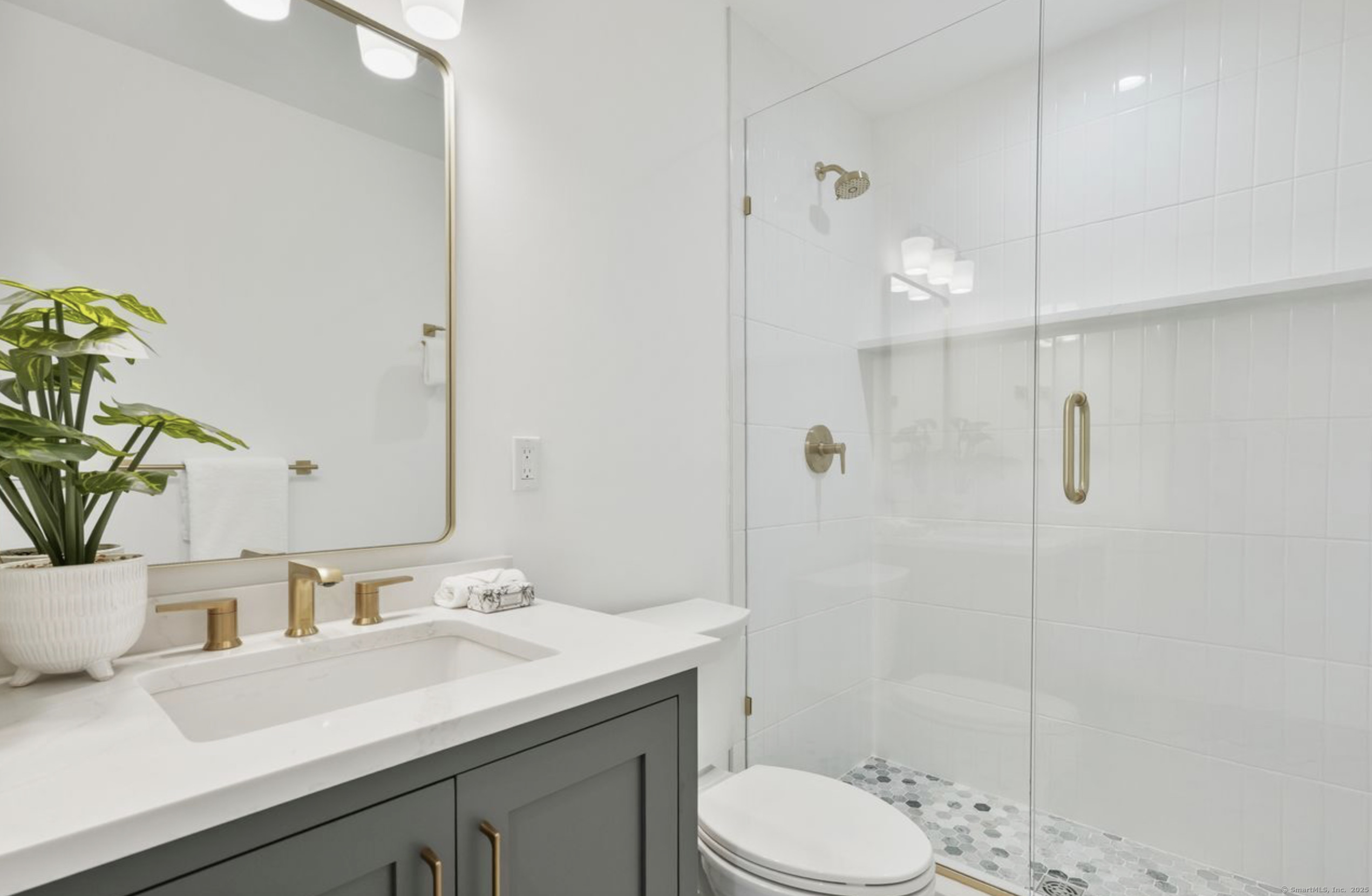 13 Terhune Drive Westport, CT 06880 - Photo 19 of 28 a bathroom with a shower sink vanity mirror and toilet