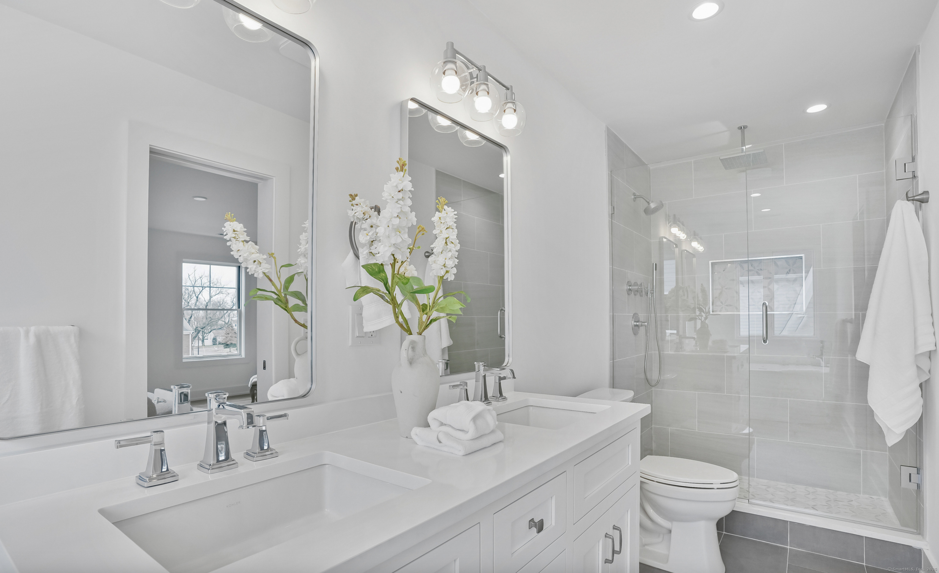 13 Terhune Drive Westport, CT 06880 - Photo 20 of 28 a bathroom with a sink a toilet and shower