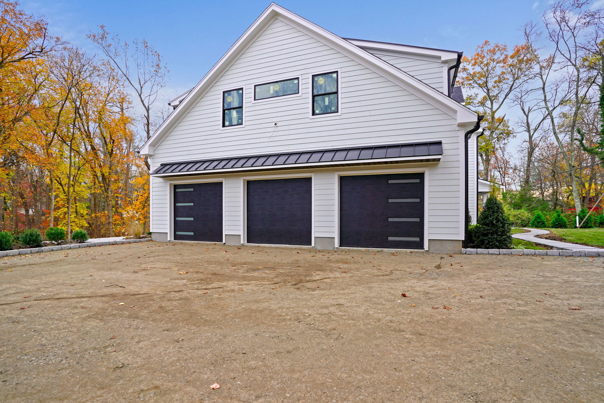 13 Terhune Drive Westport, CT 06880 - Photo 27 of 28 a front view of a house with a yard and garage