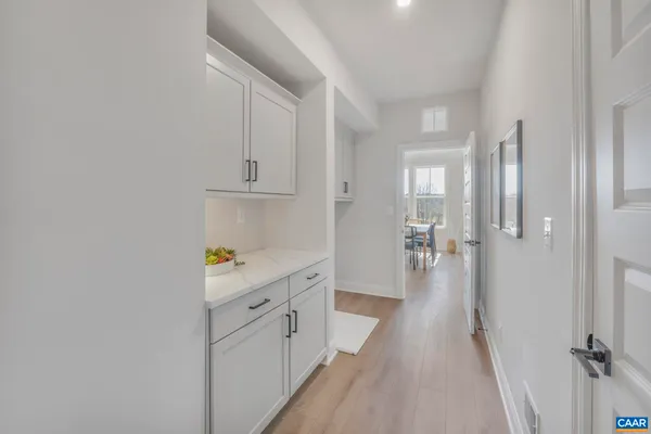 a view of a hallway with a wooden floors