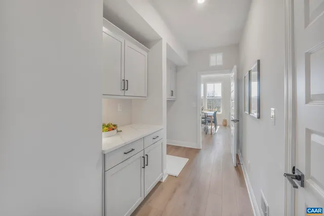 a view of a hallway with a wooden floors
