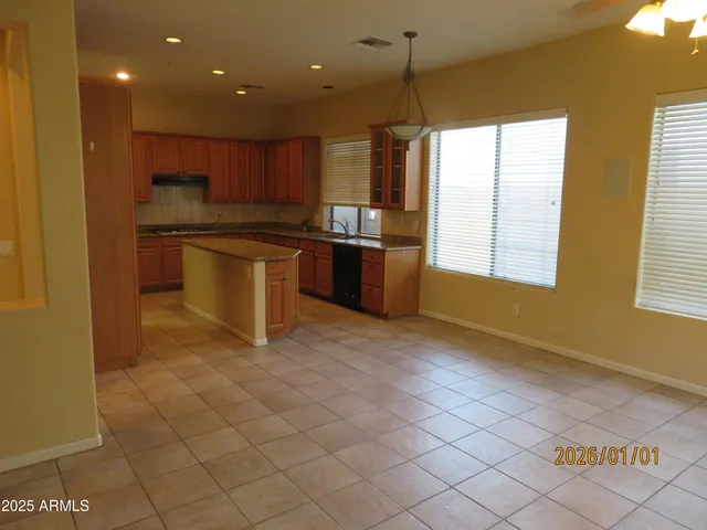 an empty room with a empty space and window