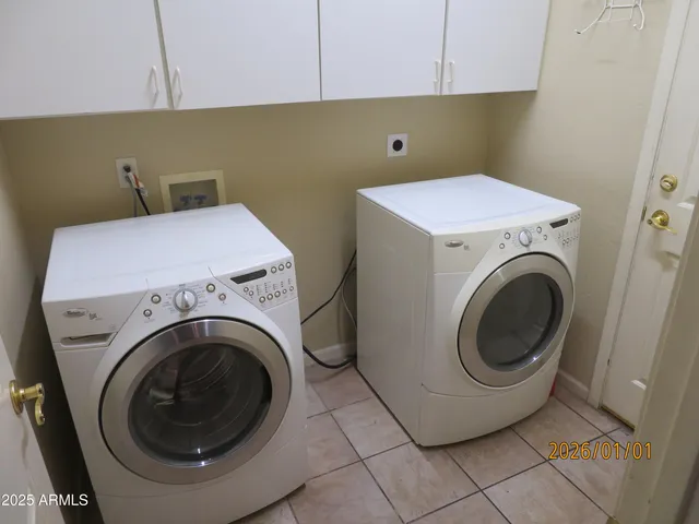 a white toilet sitting next to a bath tub