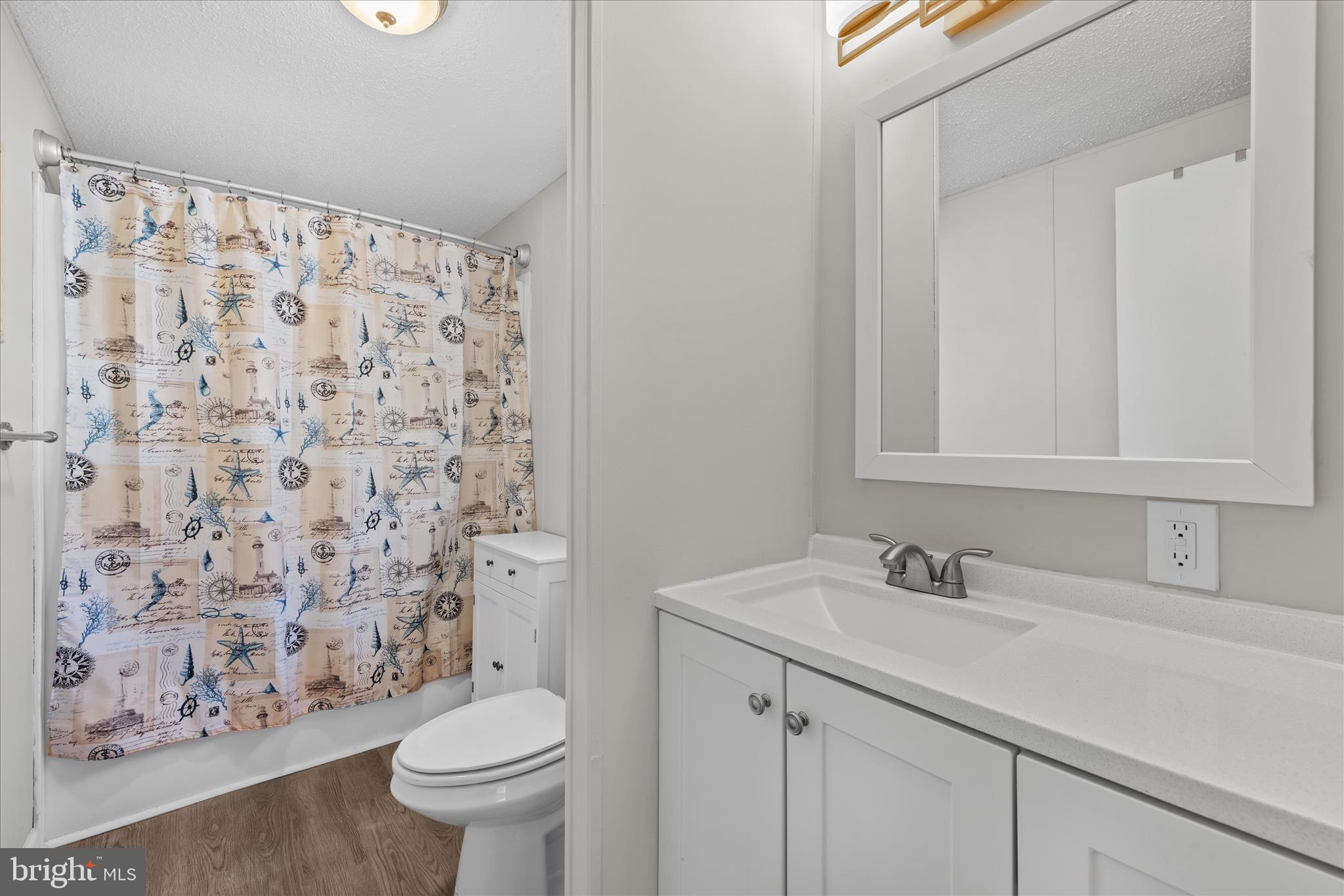 30 Woodlyn Road Millsboro, DE 19966 - Photo 20 of 44 a bathroom with a sink toilet and shower