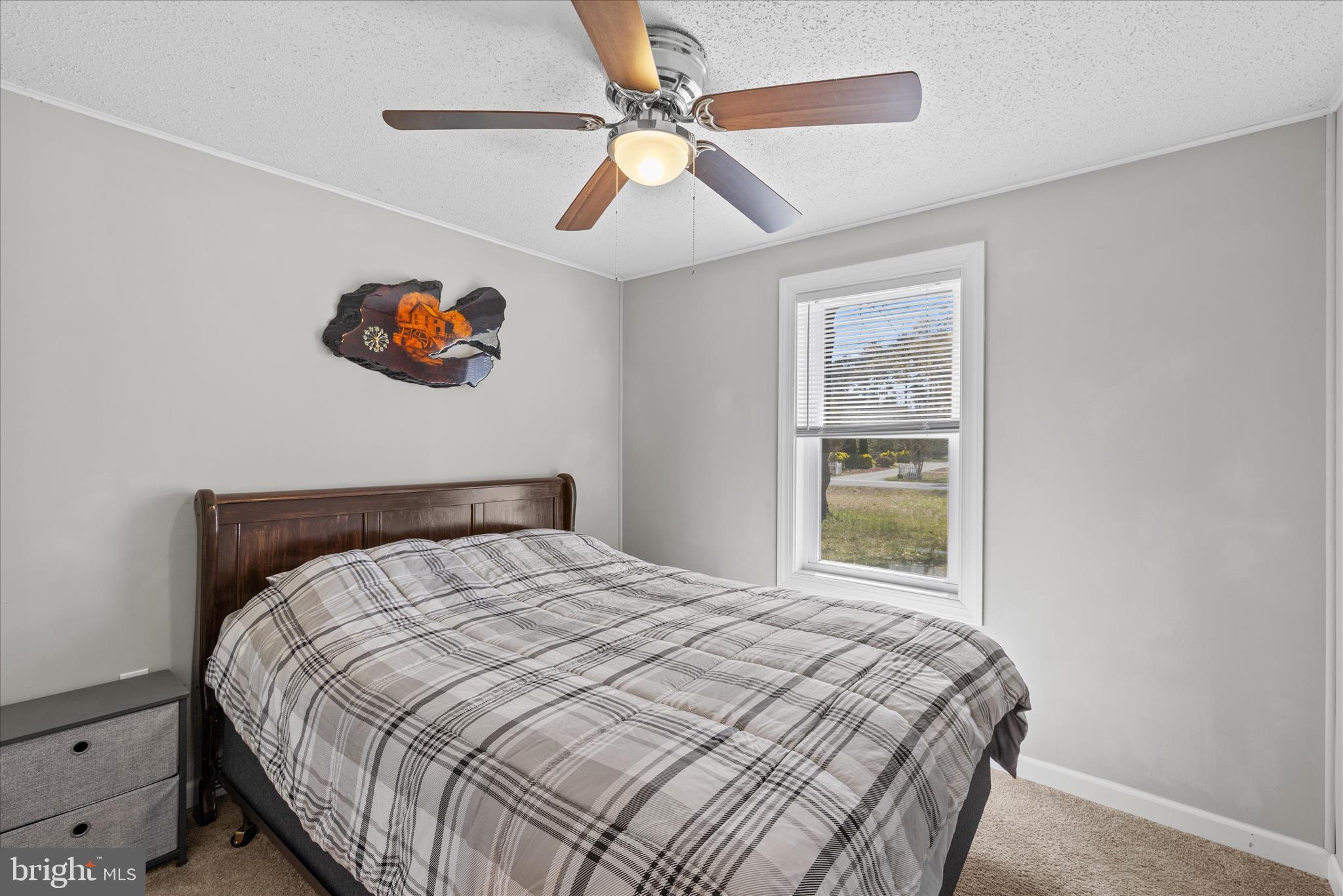30 Woodlyn Road Millsboro, DE 19966 - Photo 21 of 44 a bedroom with a bed and a window