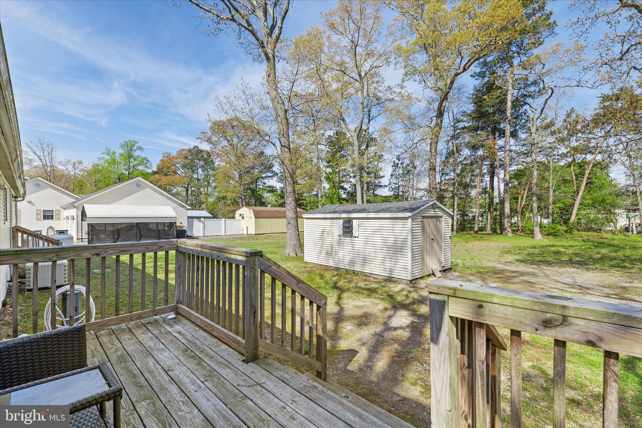 30 Woodlyn Road Millsboro, DE 19966 - Photo 28 of 44 a view of a wooden deck and a yard