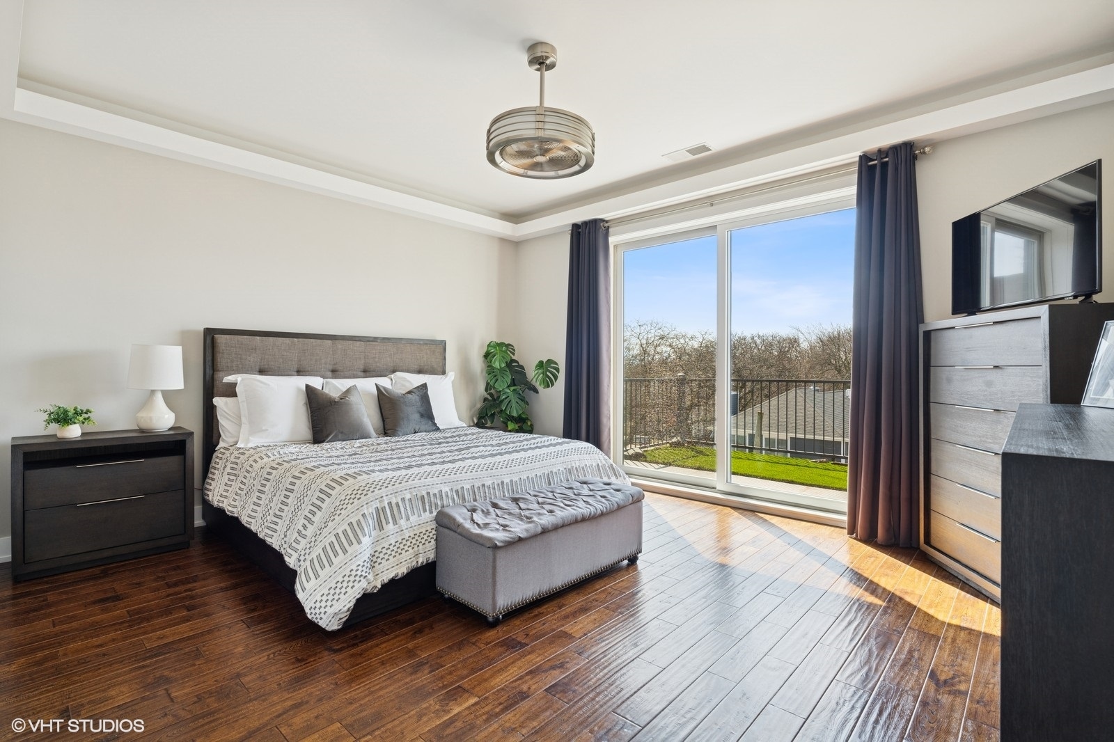 Undisclosed Address Chicago, IL 60657 - Photo 11 of 27 a spacious bedroom with a bed and a large window
