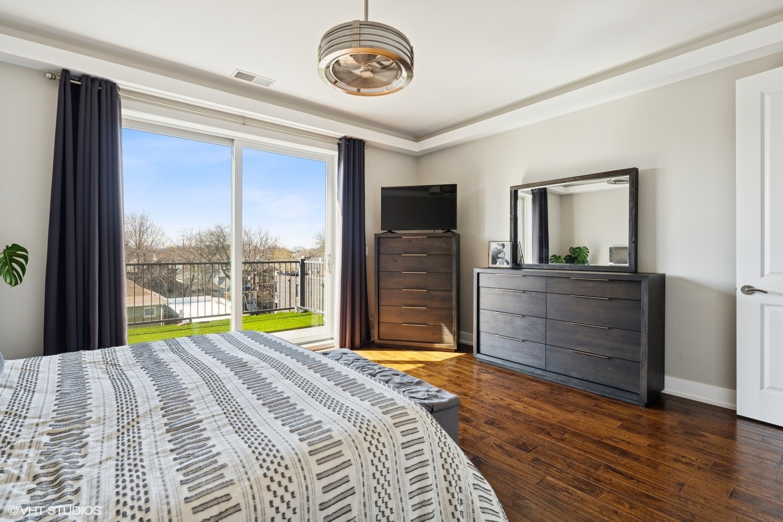 Undisclosed Address Chicago, IL 60657 - Photo 13 of 27 a bedroom with a bed and a dresser