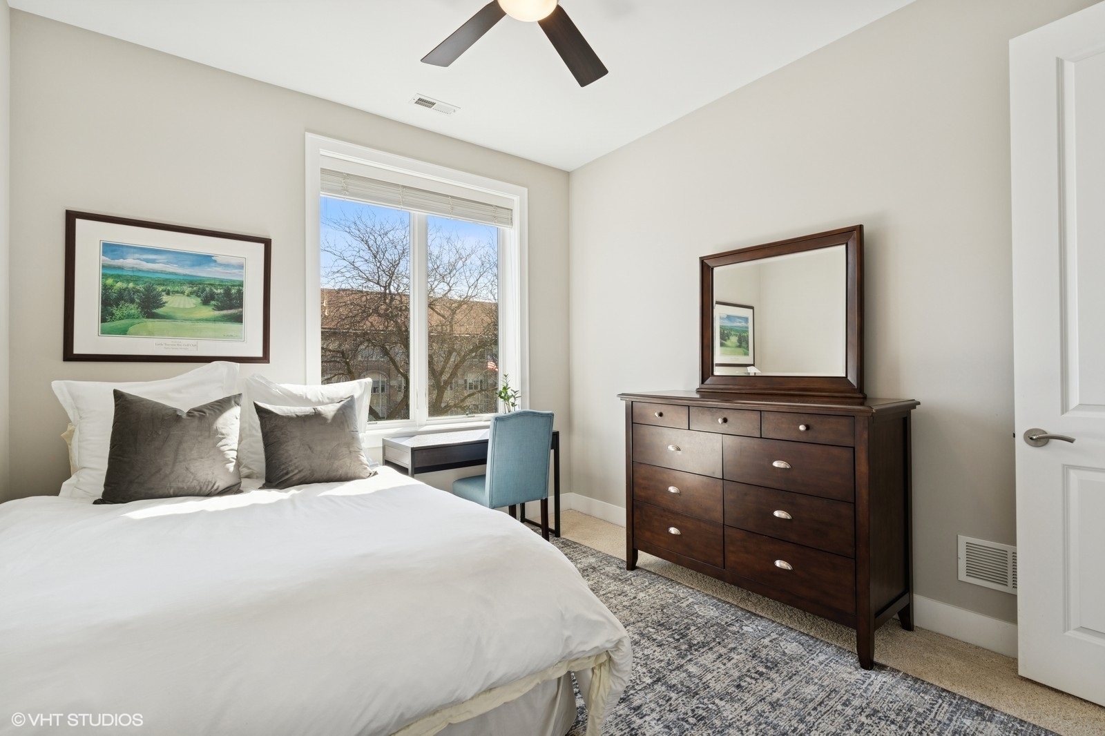 Undisclosed Address Chicago, IL 60657 - Photo 15 of 27 a bedroom with a bed and a dresser