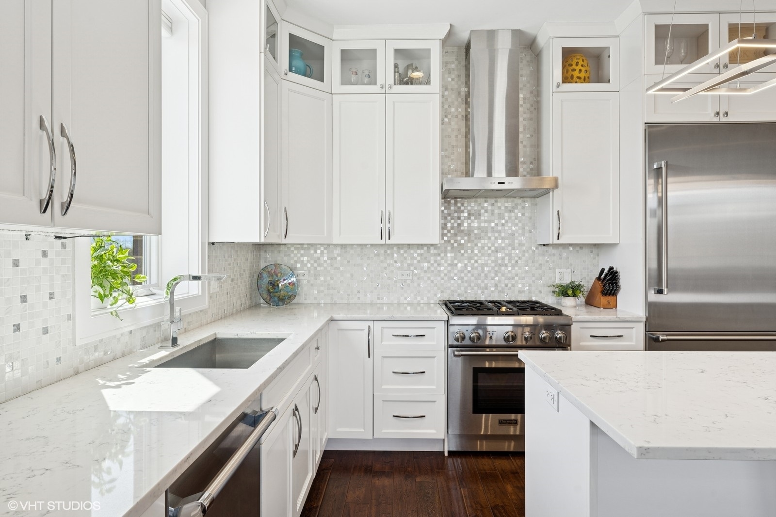 Undisclosed Address Chicago, IL 60657 - Photo 4 of 27 a kitchen with granite countertop a sink stainless steel appliances and cabinets