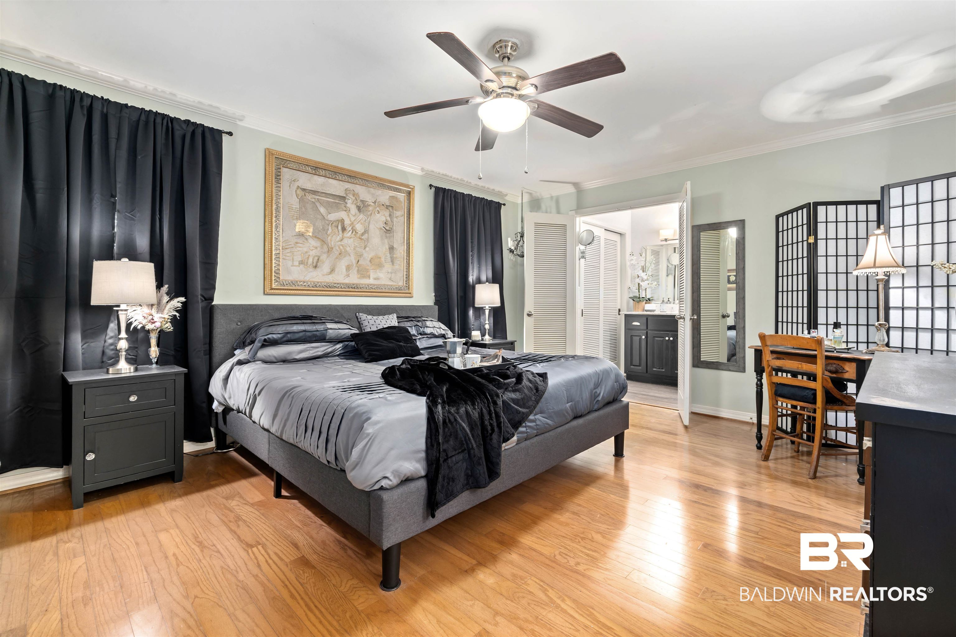 4051 East Canal Circle Mobile, AL 36619 - Photo 17 of 32 Bedroom with crown molding, connected bathroom, light hardwood / wood-style flooring, and ceiling fan