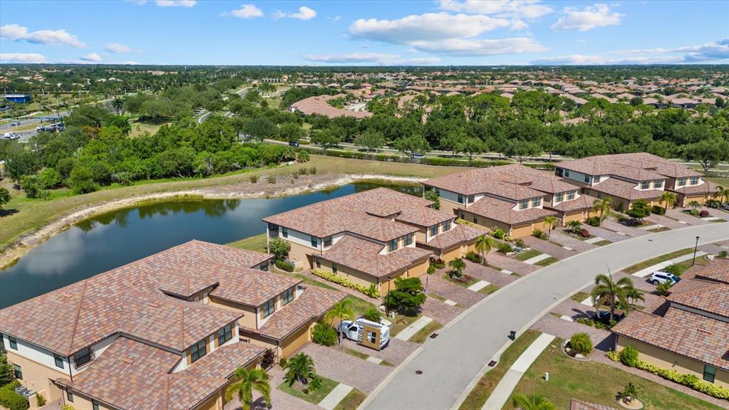 20080 Ragazza Circle, Unit 102 Venice, FL 34293 - Photo 6 of 49 an aerial view of a house with a lake view