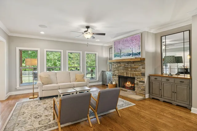 a dining room with furniture and wooden floor