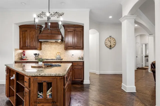 a kitchen with a stove and cabinets