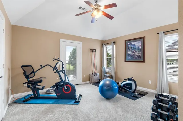 a view of a balcony with wooden floor and fence