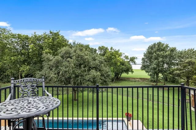 a view of a chairs and table in the patio