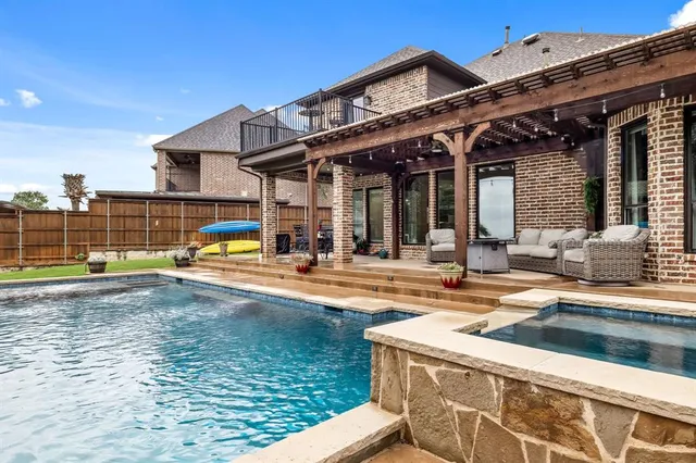 a view of a patio with couches table and chairs
