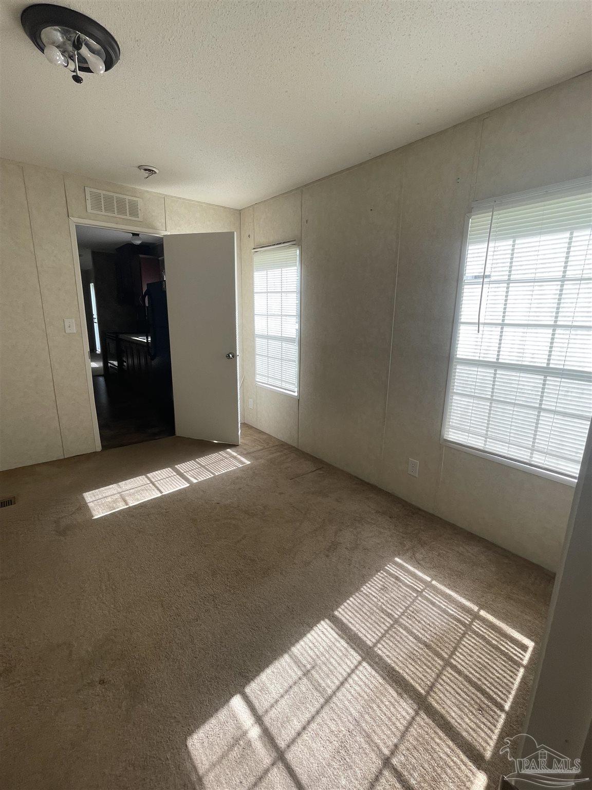 9520 Bridlewood Road Pensacola, FL 32526 - Photo 12 of 19 a view of an empty room with a window