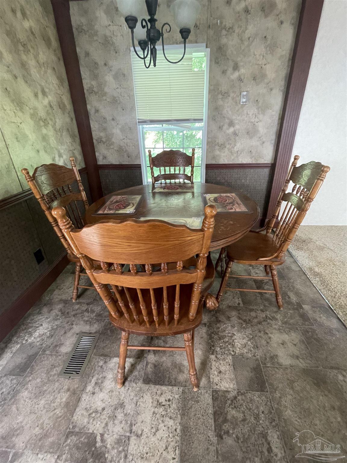 9520 Bridlewood Road Pensacola, FL 32526 - Photo 13 of 19 a view of a room with table and chairs