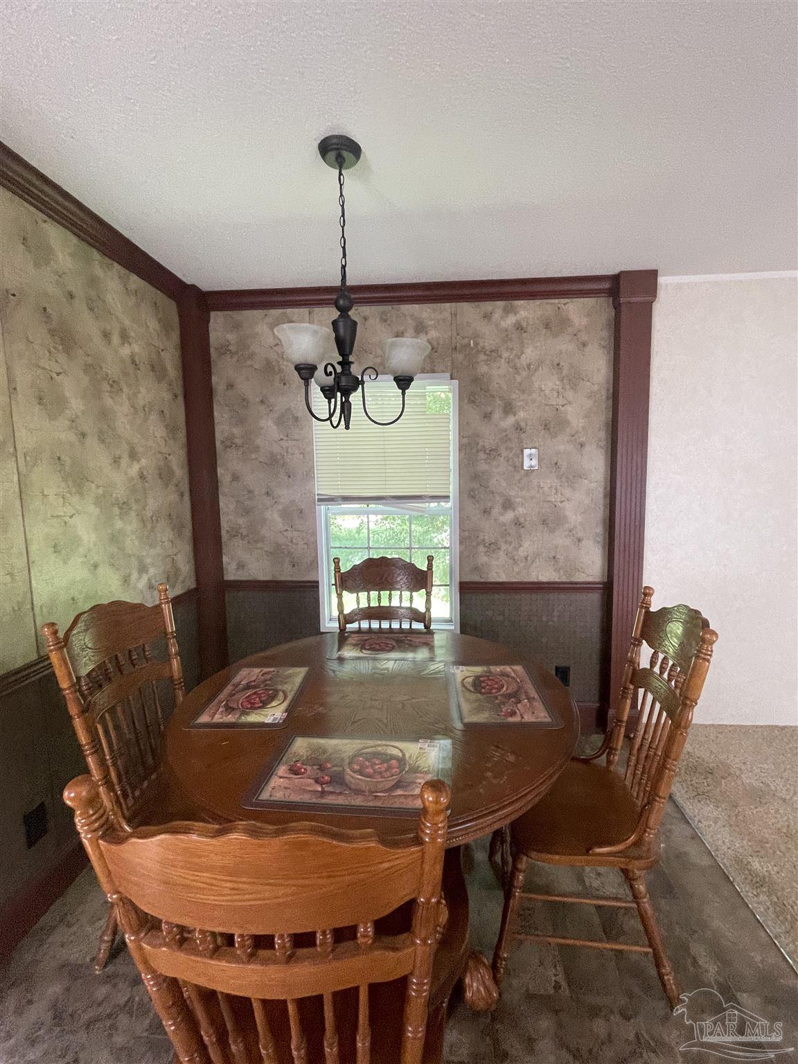 9520 Bridlewood Road Pensacola, FL 32526 - Photo 14 of 19 a view of a dining room with furniture and wooden floor