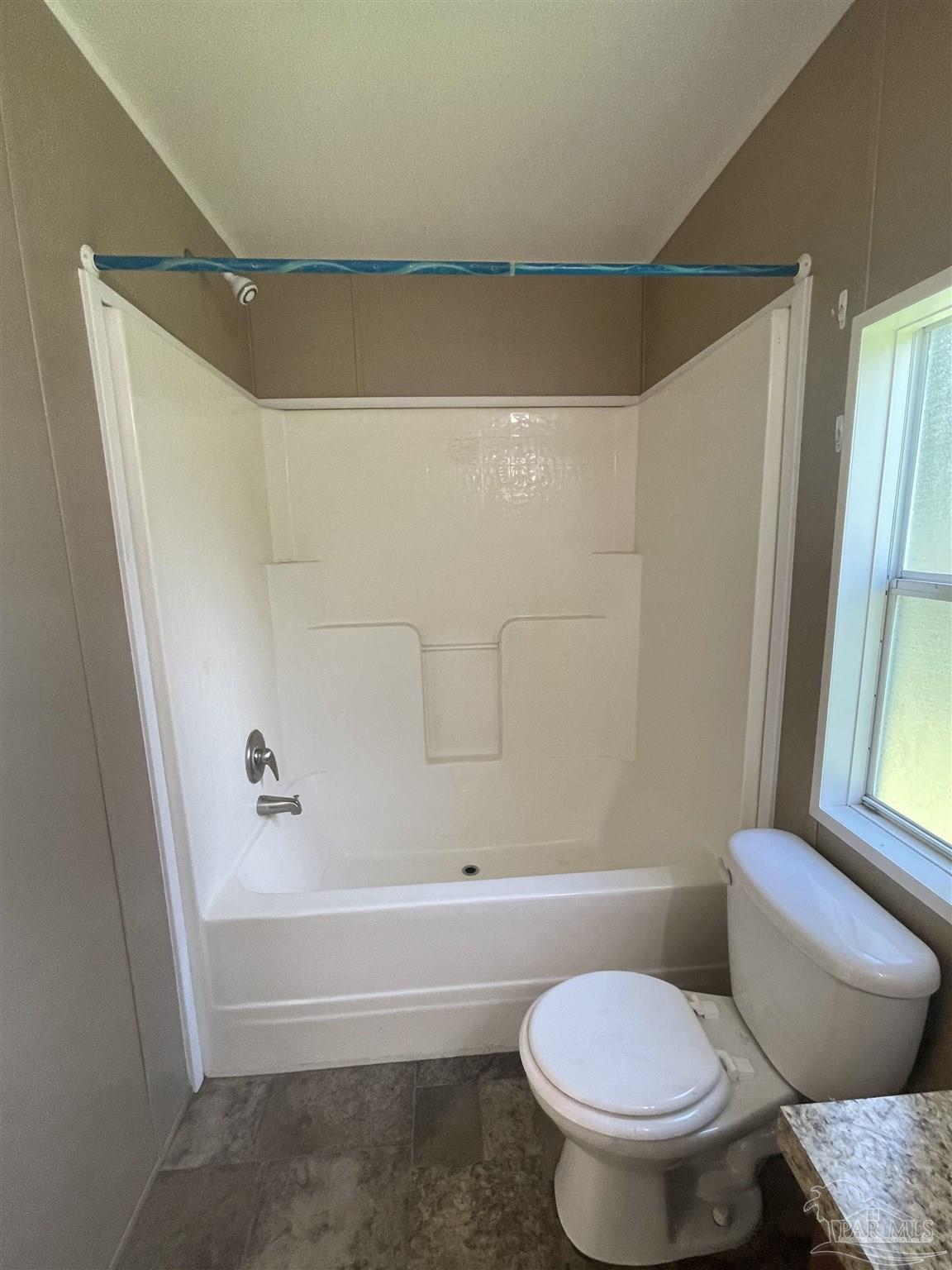 9520 Bridlewood Road Pensacola, FL 32526 - Photo 2 of 19 a bathroom with a toilet and a bath tub