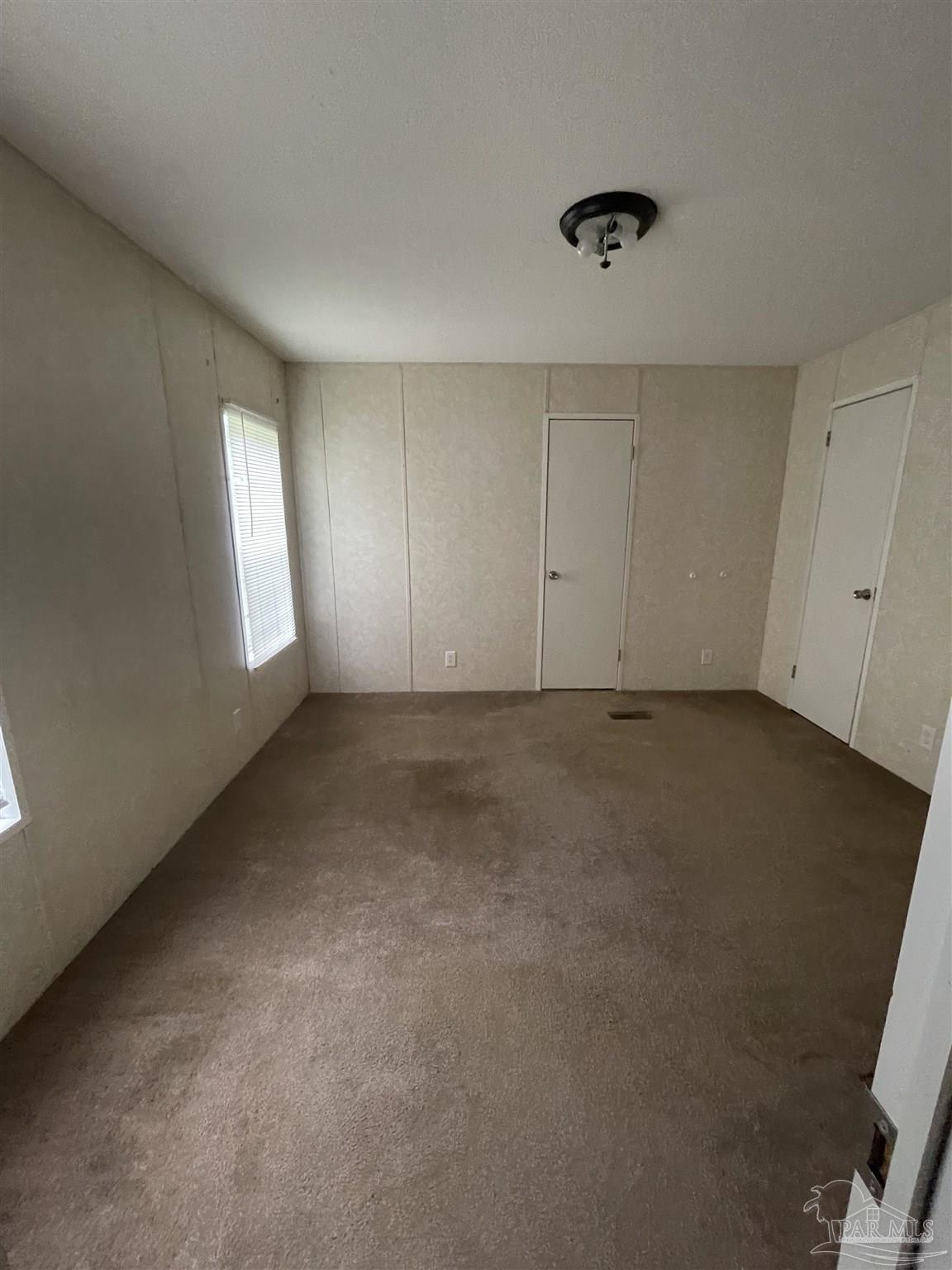 9520 Bridlewood Road Pensacola, FL 32526 - Photo 9 of 19 a view of an empty room with a window