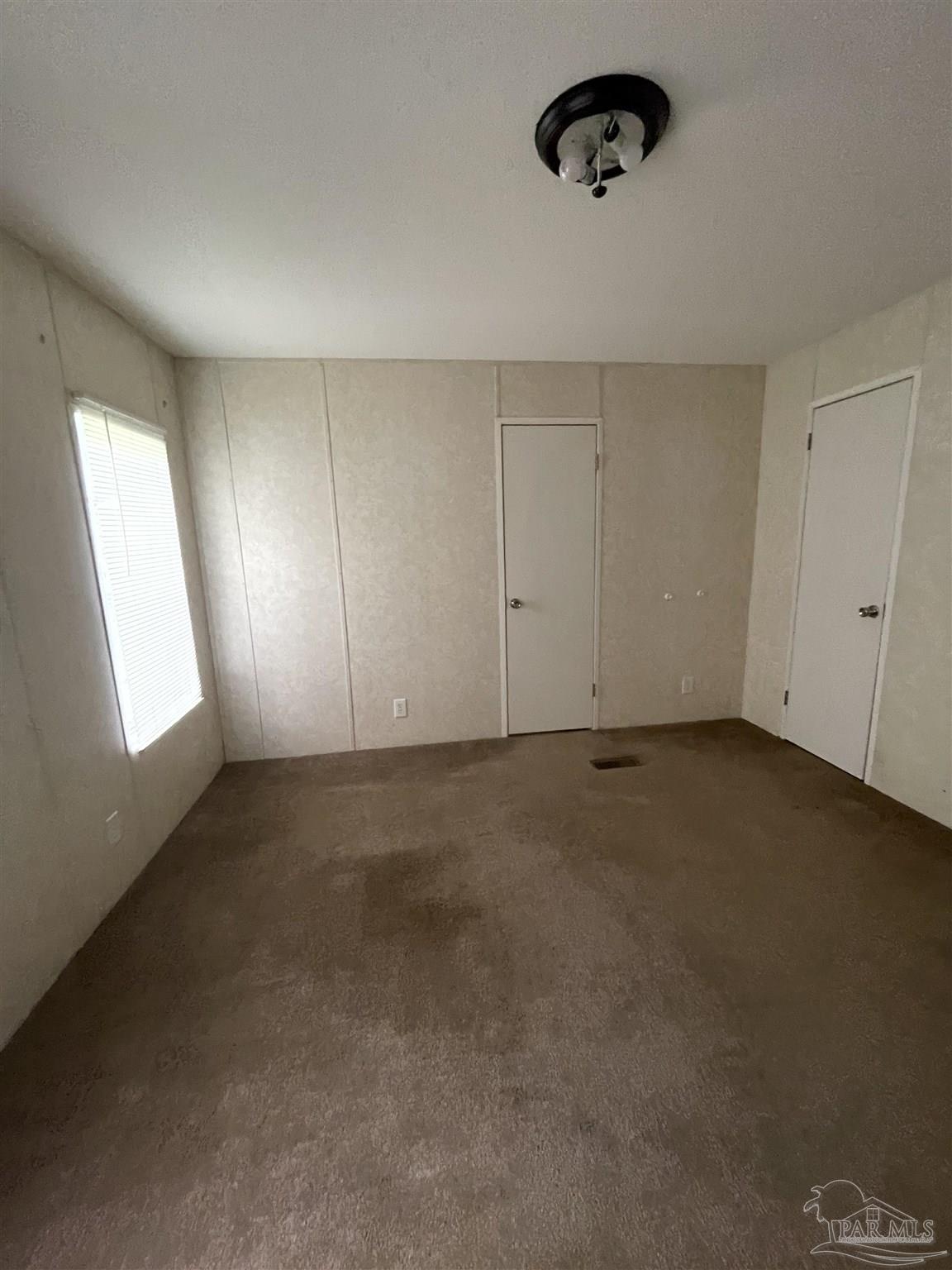 9520 Bridlewood Road Pensacola, FL 32526 - Photo 10 of 19 an empty room with windows and closet