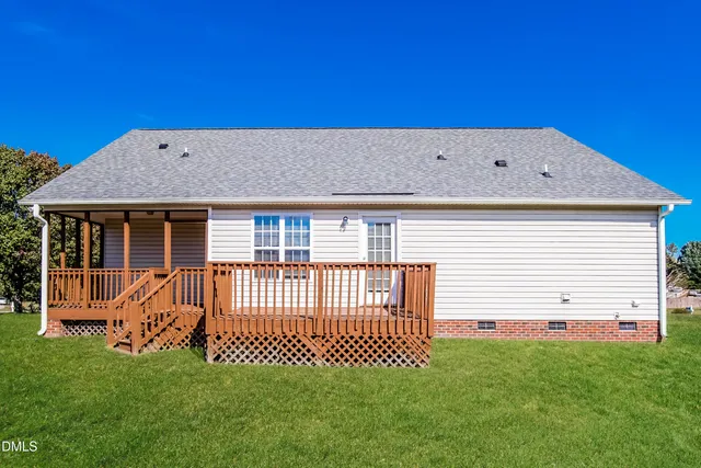 a backyard of a house with a deck