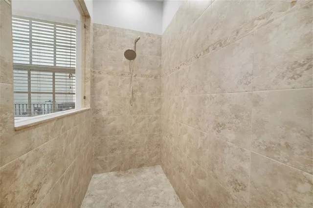 a view of a lake with houses in the back