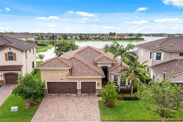 a aerial view of a house with a garden and balcony