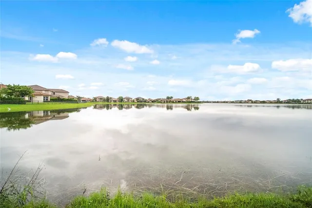 an aerial view of residential houses with outdoor space and street view